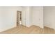 Simple bedroom with wood flooring and access to hallway at 112 N Guthrie Ave # B, Durham, NC 27703