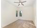 Bright bedroom with wood flooring and ceiling fan at 112 N Guthrie Ave # B, Durham, NC 27703