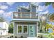 Modern two-story home with a green door and balcony at 112 N Guthrie Ave # C, Durham, NC 27703