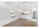 Modern dining room with hardwood floors and chandelier at 112 N Guthrie Ave # C, Durham, NC 27703