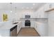 Modern kitchen with white cabinets and stainless steel appliances at 112 N Guthrie Ave # C, Durham, NC 27703