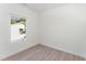 Simple bedroom with hardwood floors and one window at 112 N Guthrie Ave # C, Durham, NC 27703