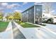 Gray modern home with a concrete driveway and landscaping at 112 N Guthrie Ave # C, Durham, NC 27703