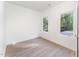 Bright bedroom with hardwood floors and two large windows at 112 N Guthrie Ave # C, Durham, NC 27703