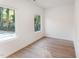 Bright bedroom with hardwood floors and large windows at 112 N Guthrie Ave, Durham, NC 27703