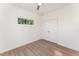 Charming bedroom with hardwood floors, window, and double doors at 112 N Guthrie Ave, Durham, NC 27703