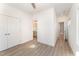 Well-lit bedroom with hardwood floors and en-suite bathroom at 112 N Guthrie Ave, Durham, NC 27703