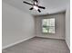 Bedroom with ceiling fan and grey carpeting at 1414 Arborgate Cir, Chapel Hill, NC 27514