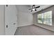 Bedroom with ceiling fan, carpeting, and double doors at 1414 Arborgate Cir, Chapel Hill, NC 27514