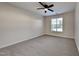 Spacious bedroom with ceiling fan and grey carpeting at 1414 Arborgate Cir, Chapel Hill, NC 27514