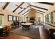 Spacious game room includes a pool table, shuffleboard, and bar area at 2117 Blue Haven Ct, Wake Forest, NC 27587