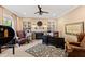 Home office with built-in shelves, fireplace, and comfortable leather chairs at 2117 Blue Haven Ct, Wake Forest, NC 27587