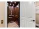 Elegant wood-paneled elevator for convenient access at 2117 Blue Haven Ct, Wake Forest, NC 27587