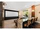 Home theater with large screen, comfortable seating, and bar at 2117 Blue Haven Ct, Wake Forest, NC 27587