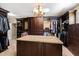 Large walk-in Primary closet with custom built-ins and granite countertop at 2117 Blue Haven Ct, Wake Forest, NC 27587