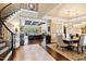 Bright dining room with a large table and chandelier, open to the living room at 2117 Blue Haven Ct, Wake Forest, NC 27587