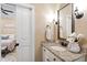 Small bathroom with white vanity, granite countertop and decorative accents at 2117 Blue Haven Ct, Wake Forest, NC 27587