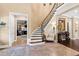 Elegant curved staircase with ornate railing in a spacious foyer at 2117 Blue Haven Ct, Wake Forest, NC 27587