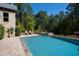 Inviting, expansive pool with adjacent spa and landscaping at 2117 Blue Haven Ct, Wake Forest, NC 27587