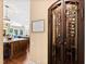 Elegant wine cellar with wrought-iron door and ample storage for wine bottles at 2117 Blue Haven Ct, Wake Forest, NC 27587