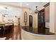 Custom wet bar with granite countertop and glass-front cabinetry at 2117 Blue Haven Ct, Wake Forest, NC 27587