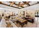 Open living space with hardwood floors, exposed beams, and views to kitchen at 2117 Blue Haven Ct, Wake Forest, NC 27587