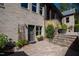 Stone patio with access to the home and landscaping at 2117 Blue Haven Ct, Wake Forest, NC 27587