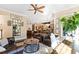 Cozy sitting area with leather chairs and a view into the kitchen at 2117 Blue Haven Ct, Wake Forest, NC 27587