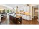 Large kitchen island with seating and extensive granite countertops at 2117 Blue Haven Ct, Wake Forest, NC 27587