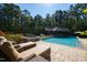 Relaxing pool area with lounge chairs and plenty of space for entertaining at 2117 Blue Haven Ct, Wake Forest, NC 27587