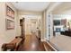 Bright hallway with hardwood floors and views into living room at 2117 Blue Haven Ct, Wake Forest, NC 27587