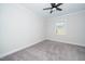 Bright bedroom with neutral walls and grey carpet at 4953 Enlightenment Rd, Raleigh, NC 27616