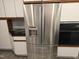 Stainless steel refrigerator with an integrated water dispenser at 38 London Ln, Mebane, NC 27302