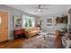 Living room features hardwood floors, a comfortable couch, and a bay window at 113 Higbee St, Durham, NC 27704