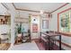 Bright dining area with wood table and bench, and a stained-glass window at 113 Higbee St, Durham, NC 27704