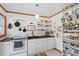 Bright kitchen with white cabinets, wood countertops, and open shelving at 113 Higbee St, Durham, NC 27704