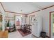 White kitchen with wood-look floors and a large refrigerator at 113 Higbee St, Durham, NC 27704