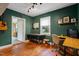 Bright home office features wood floors, built-in shelving, and a view of the backyard at 113 Higbee St, Durham, NC 27704