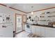 Modern kitchen with white cabinets, wood countertops, and a farmhouse sink at 113 Higbee St, Durham, NC 27704