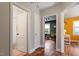 Hallway with hardwood floors and doors to bedrooms and a bathroom at 113 Higbee St, Durham, NC 27704