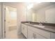 Double vanity bathroom with dark countertop at 21 Abingdon Farms Dr, Selma, NC 27576