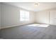 Well-lit bedroom featuring carpet and a window at 21 Abingdon Farms Dr, Selma, NC 27576