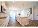 Spacious kitchen with large island, stainless steel appliances and hardwood floors at 21 Abingdon Farms Dr, Selma, NC 27576