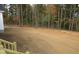 Large backyard with cleared area and wooded backdrop at 265 Coats Ridge Dr, Benson, NC 27504