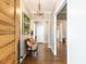 Bright entryway with hardwood floors, chandelier, and bench at 3108 Agecroft Rd, Raleigh, NC 27608