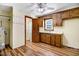 Galley kitchen with wood cabinets and a small bathroom at 450 Christmas Light Rd, Kenly, NC 27542