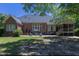 Brick house with a screened porch and a patio at 512 W Franklin St, Zebulon, NC 27597