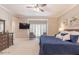 Main bedroom with king-size bed, sitting area, and large windows at 512 W Franklin St, Zebulon, NC 27597