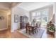 Formal dining room with hardwood floors and large windows at 512 W Franklin St, Zebulon, NC 27597