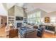 Spacious living room with a fireplace and large windows at 512 W Franklin St, Zebulon, NC 27597